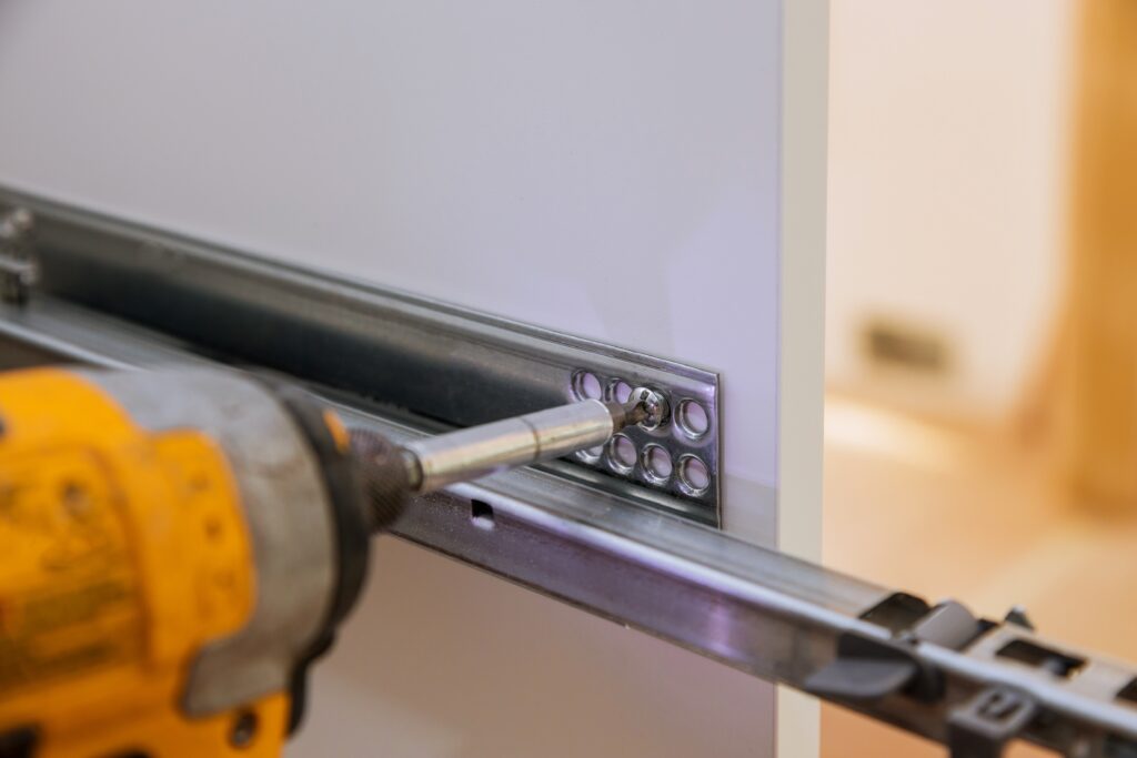 Our professional team providing expert property maintenance by installing a custom drawer for a local project.