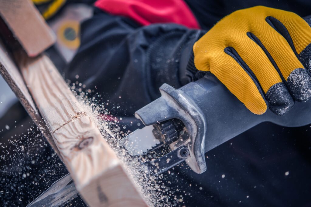 Professional handyman in Durango CO using a reciprocating saw for home repair services in Durango.